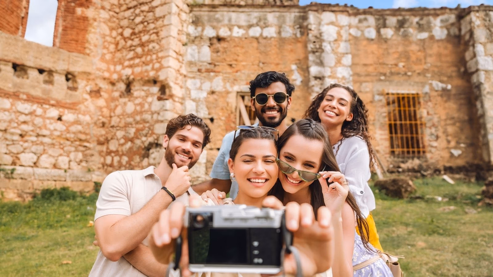 Friends taking a photo at colonial ruins in Santo Domingo